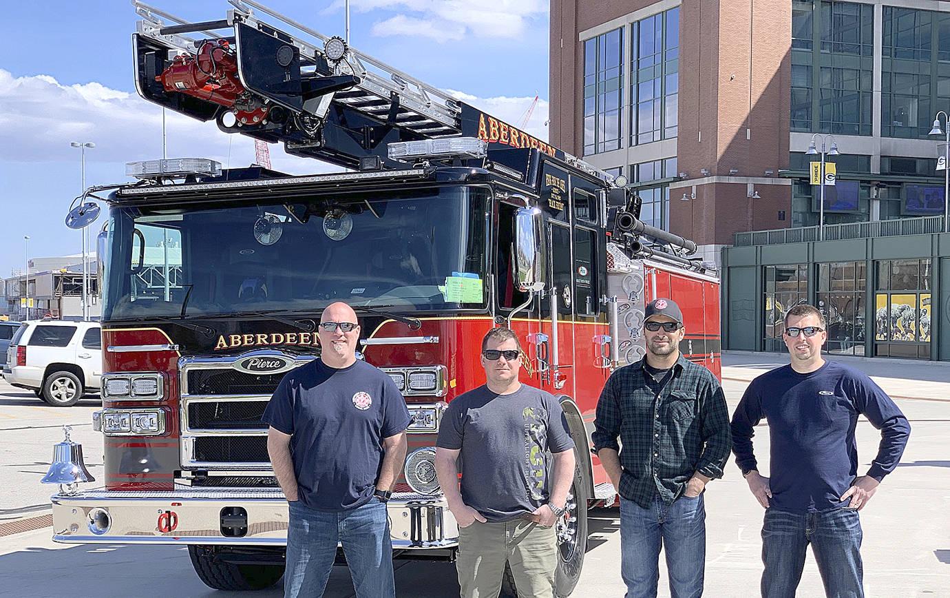 COURTESY HUGHES FIRE EQUIPMENT INC.                                 Aberdeen Fire Department new apparatus committee members flew to Appleton, Wisconsin earlier this month to inspect the city’s new pumper truck and skyboom. Pictured from left are firefighter Brian Peterson, Captain Mike Kolodzie, Captain Sam Baretich, and Engineer Brad Frafjord.