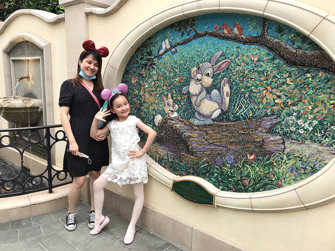 Liu Jiali, 39, and her daughter Margaret Liu, 8, were on a Disneyland trip before Margaret’s long-awaited return to second grade. (Alice Su/Los Angeles Times)