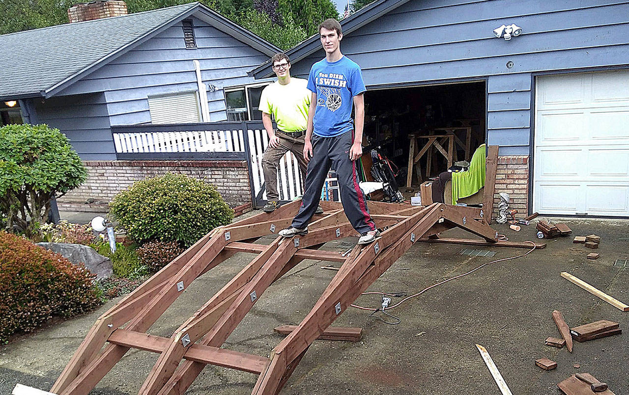Van Reynolds and his brother, Cail, in their driveway with the initial frame of the bridge he built and placed at Lake Sylvia State Park as his Eagle project. (Courtesy photo)