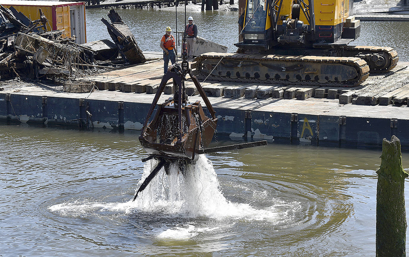 DAN HAMMOCK | GRAYS HARBOR NEWS GROUP                                 The barge was back on the Hoquiam River Wednesday as crews from Quigg Bros. began removing the sunken Lady Grace in pieces.