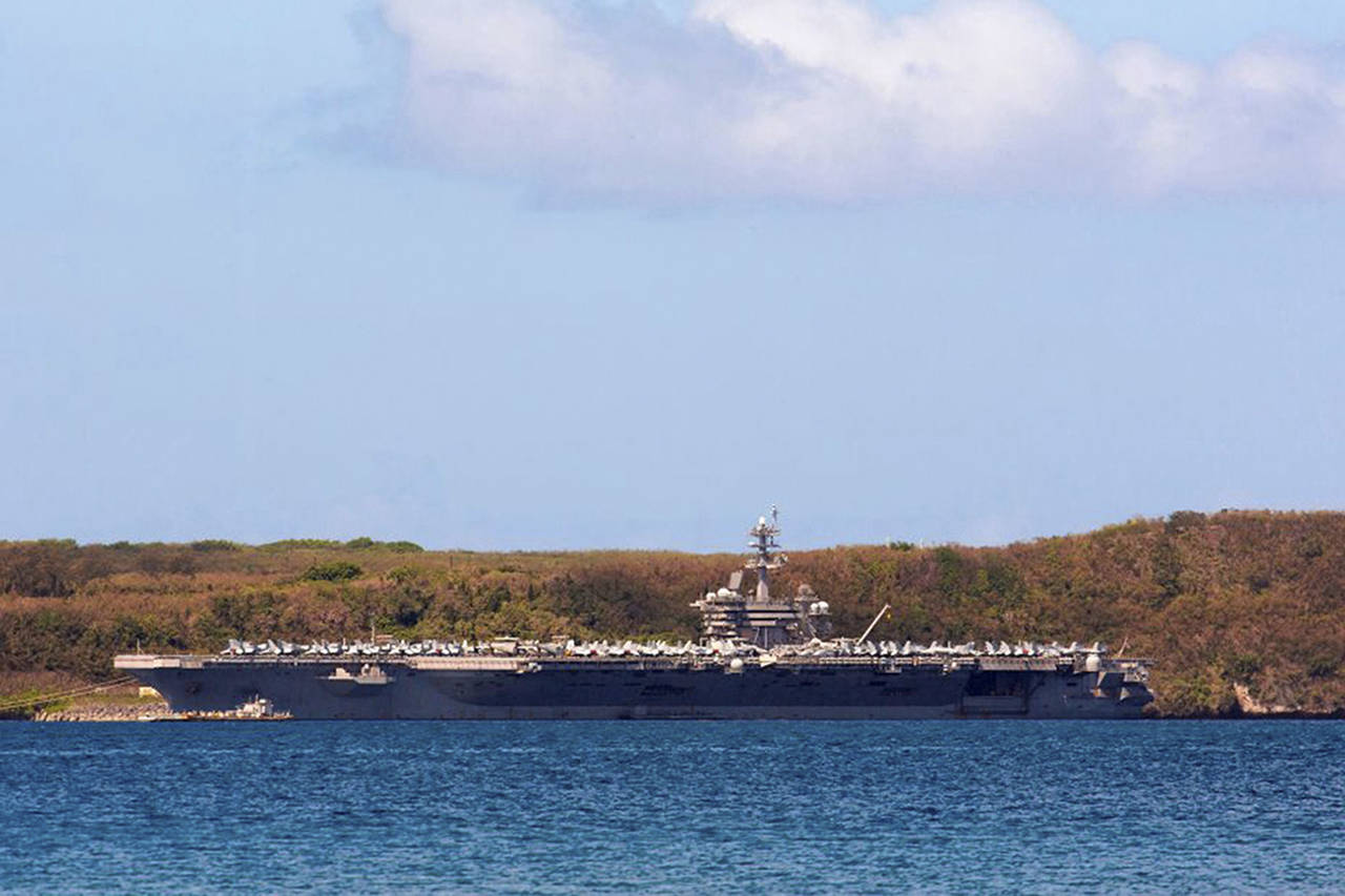 Tony Azios | AFP                                 The aircraft carrier USS Theodore Roosevelt docked at Naval Base Guam in Apra Harbor.