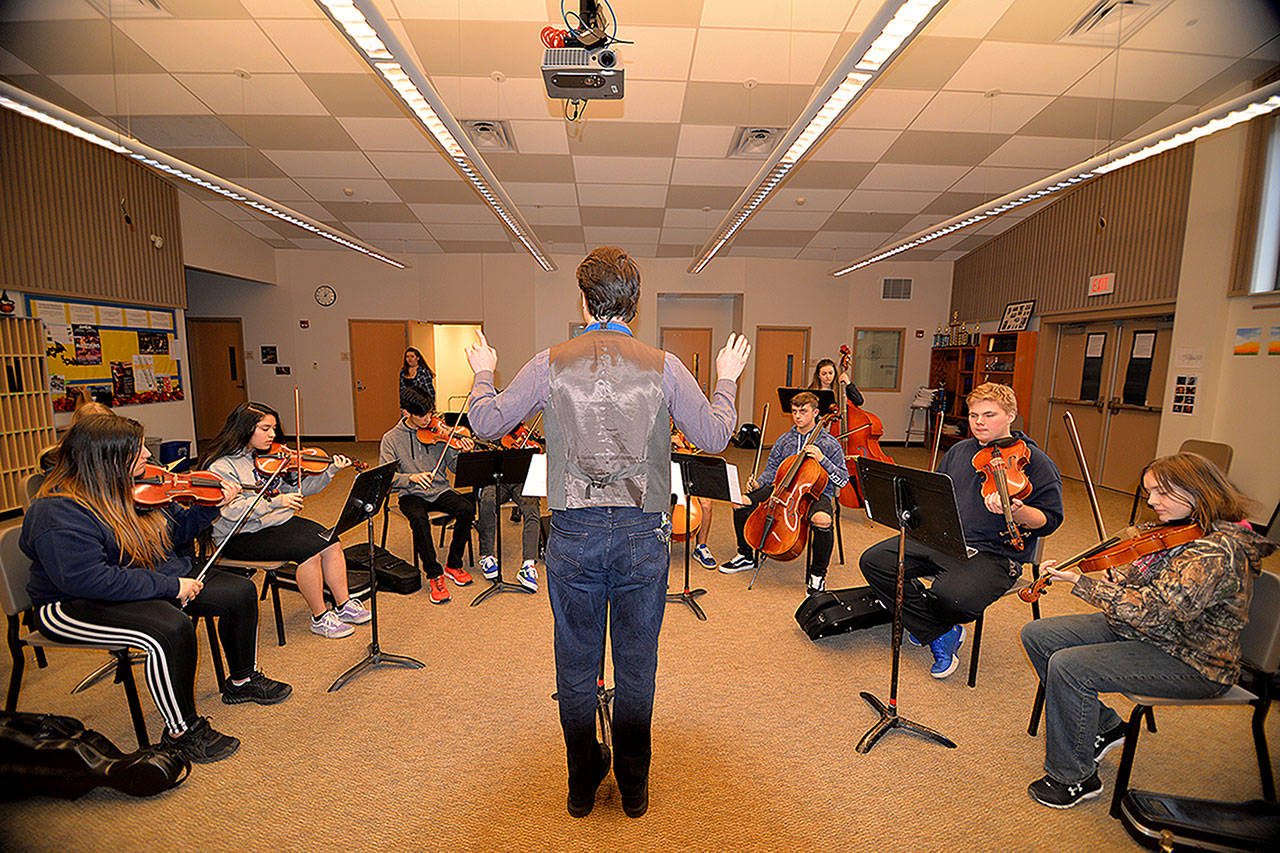 New Aberdeen High School orchestra holds conducts a rehearsal in the choir room last year. (Thorin Sprandel/The Daily World)