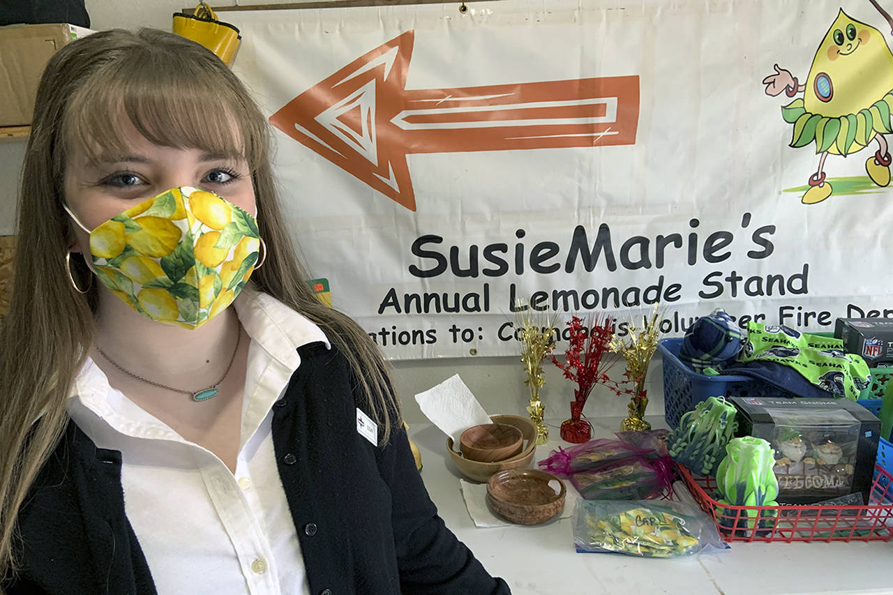 Kat Bryant | Grays Harbor News Group                                SusanMarie Peery models one of the lemon masks she will be selling Saturday as part of her final fundraiser for the Cosmopolis Volunteer Fire Department.