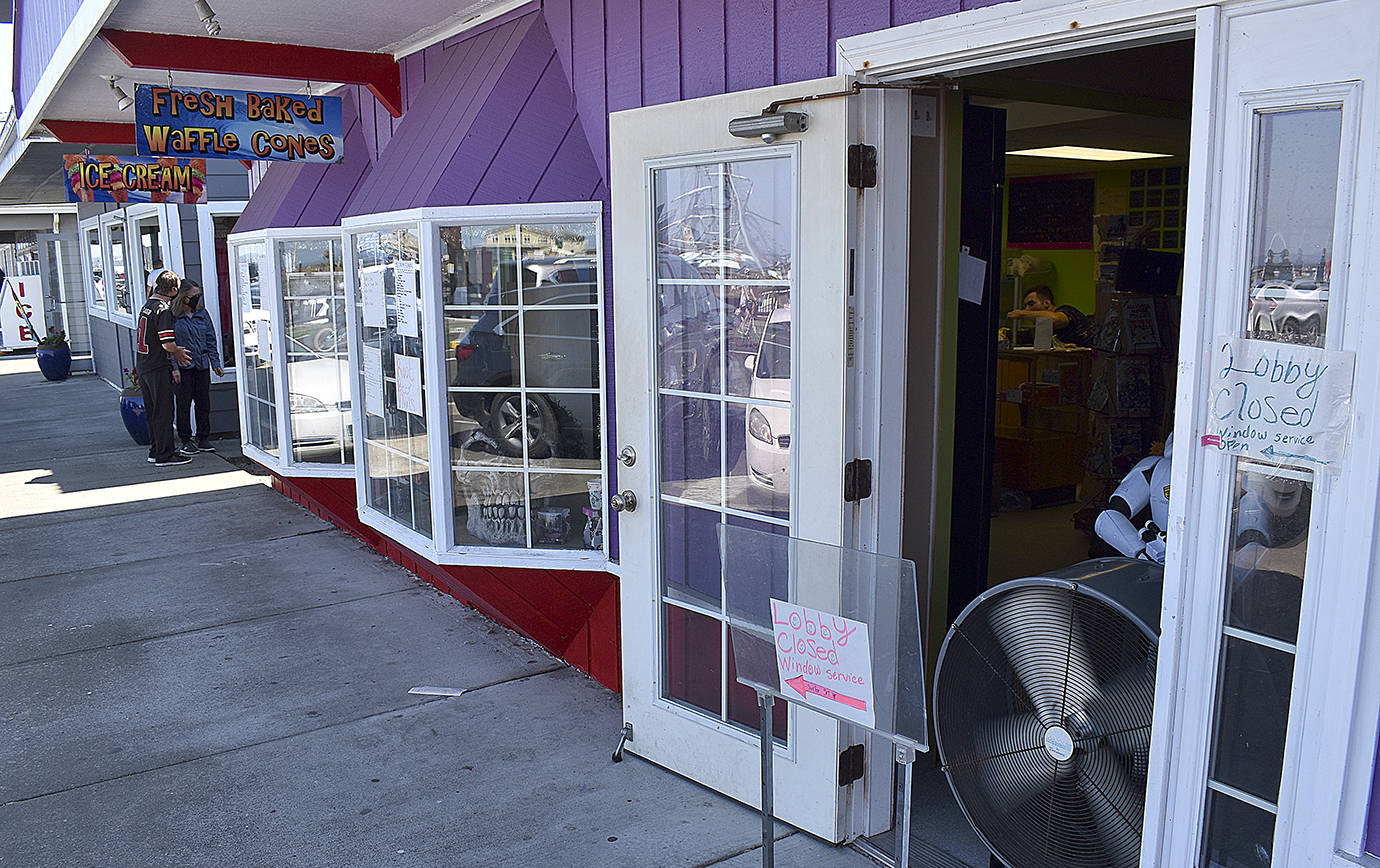 DAN HAMMOCK | GRAYS HARBOR NEWS GROUP                                 Surfer Girl Waffle Cones, Gifts and Toys has a Star Wars Stormtrooper placed at its entrance, directing a steady stream of ice cream enthusiasts to its take-out window Aug. 13.