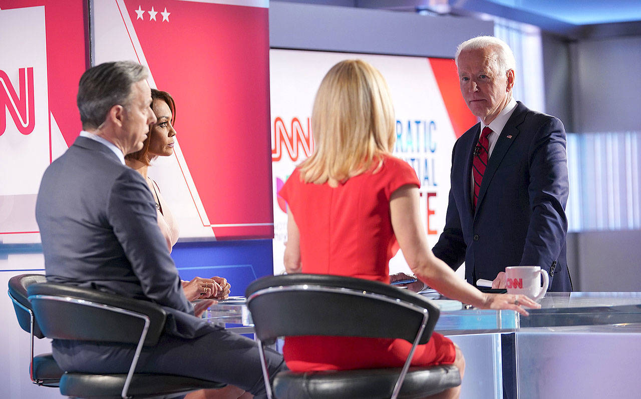 Democratic presidential candidate Joe Biden talks with moderators from CNN at the end of the 11th Democratic Party 2020 presidential debate in a CNN Washington Bureau studio in Washington, D.C., on March 15, 2020. (Mandel Ngan/Getty Images)