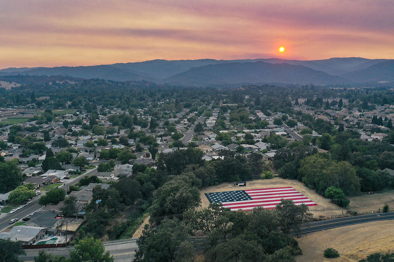 A field was painted Monday with the American flag as the city of Vacaville, California, tries to deal with the LNU Lightning Complex Fire for more than a week. (Paul Kuroda/ZUMA Wire)