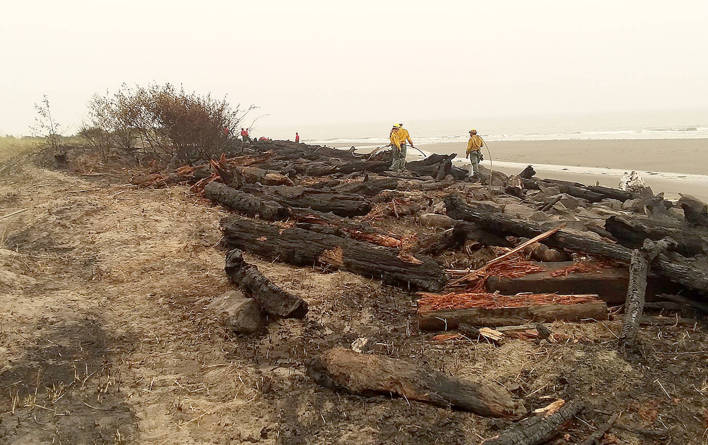 COURTESY WASH AWAY NO MORE                                 A log groin used for shoreline protection at North Cove was severely damaged by a fire Wednesday.