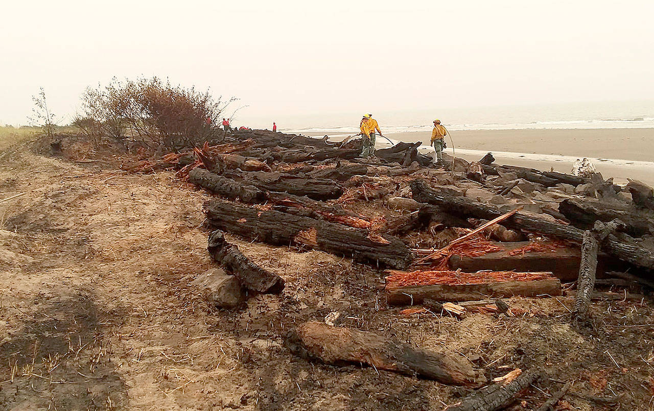 COURTESY WASH AWAY NO MORE                                 A log groin used for shoreline protection at North Cove was severely damaged by a fire Wednesday.