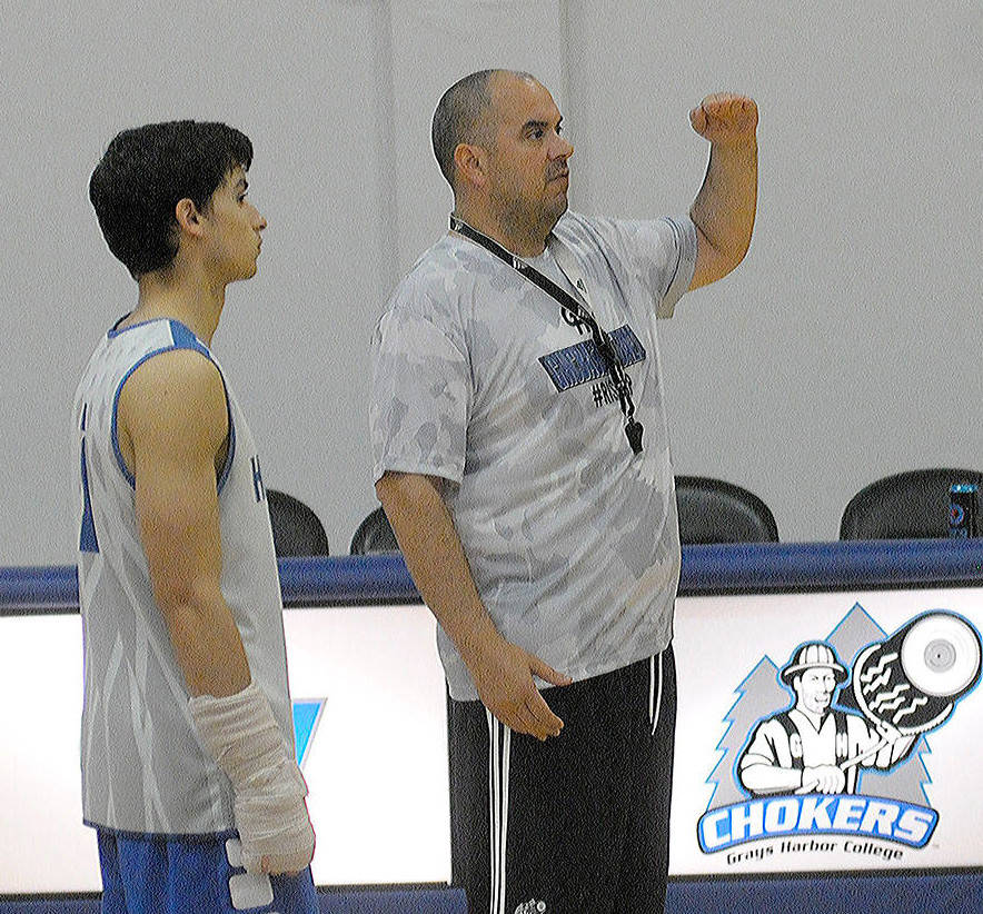 Daily World File Photo Grays Harbor College mens basketball coach Matt Vargas, right, guides his team through a practice ahead of the 2018 season. Vargas, along with GHC baseball coach Mike Bruner, spoke with The Daily World about how recruiting has changed during the coronavirus pandemic.