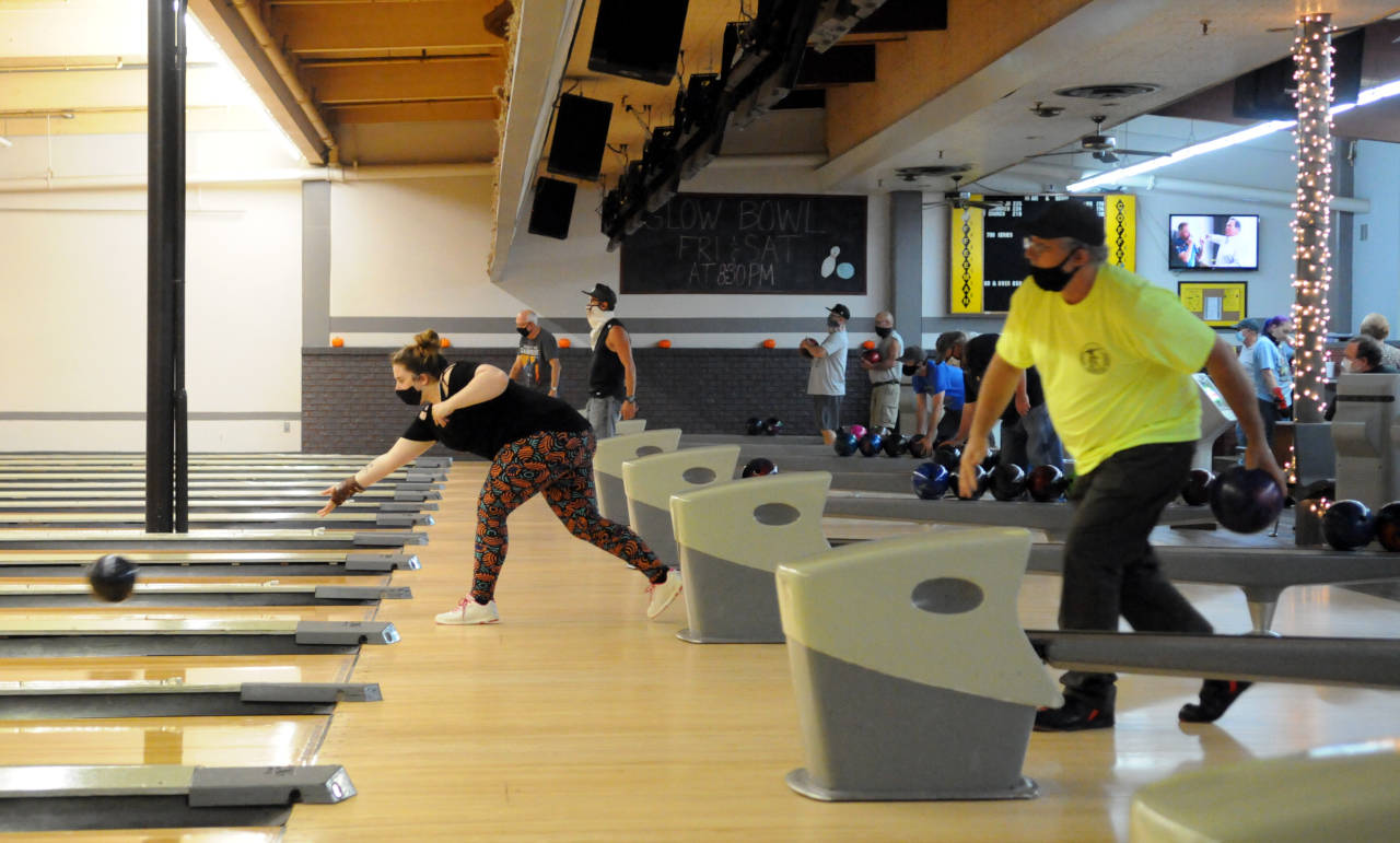 Bowlers compete in a socially-distanced version of league play at Rainier Lanes on Thursday in Aberdeen. (Ryan Sparks | The Daily World)