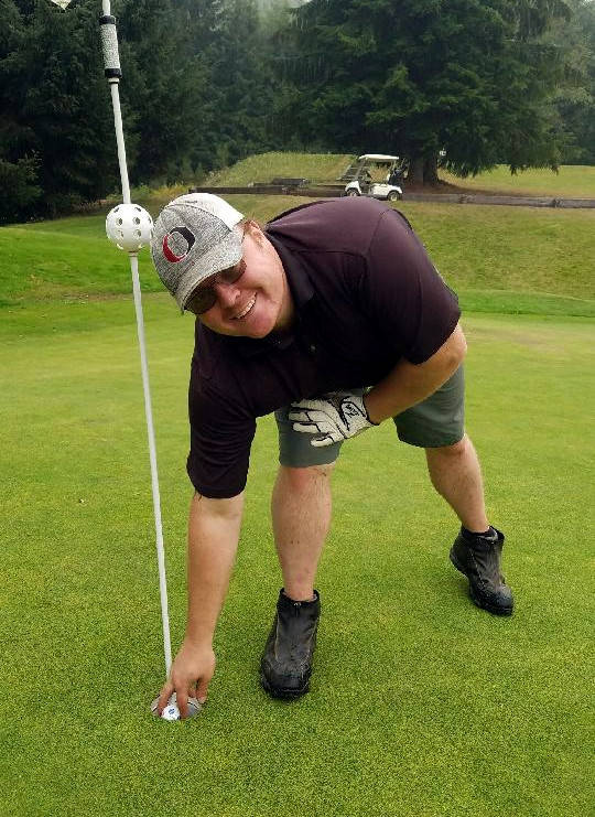 Colby Raffelson stops to pose for a photo after recording a hole in one on the 15th hole at Highland Golf Course on Wednesday, Sept. 16.