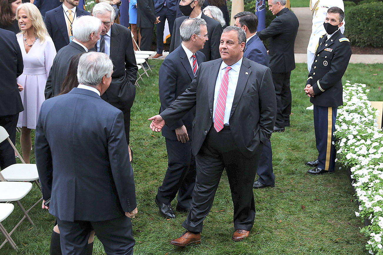 Former New Jersey Gov. Chris Christie, middle, talks with guests in the Rose Garden after President Donald Trump introduced 7th U.S. Circuit Court Judge Amy Coney Barrett as his nominee to the Supreme Court at the White House on September 26. The gathering is now being considered a possible "super-spreader" event as at least nine people, including Christie, and former Trump adviser Kellyanne Conway, far left, have contracted the disease.(Chip Somodevilla/Getty Images)