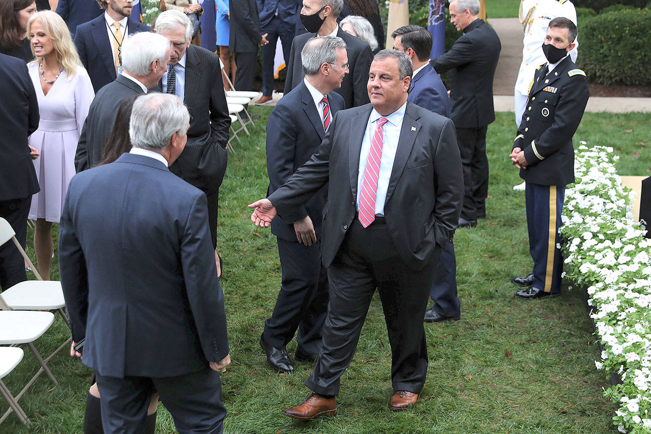 Former New Jersey Gov. Chris Christie, middle, talks with guests in the Rose Garden after President Donald Trump introduced 7th U.S. Circuit Court Judge Amy Coney Barrett as his nominee to the Supreme Court at the White House on September 26. The gathering is now being considered a possible “super-spreader” event as at least nine people, including Christie, and former Trump adviser Kellyanne Conway, far left, have contracted the disease. (Chip Somodevilla/Getty Images)