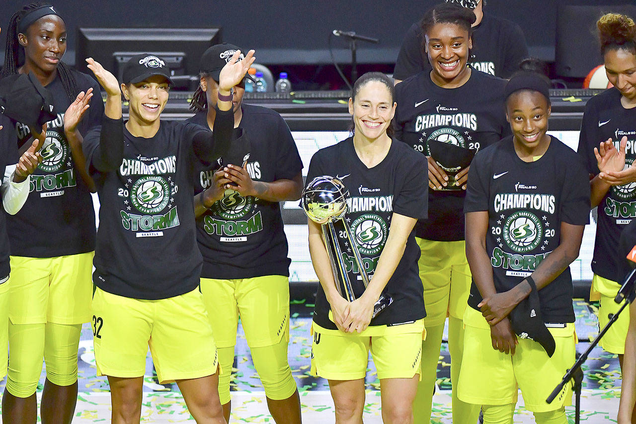 Sue Bird of the Seattle Storm holds on to the WNBA Championship Trophy after defeating the Las Vegas Aces, 92-59, in Game 3 of the WNBA Finals at Feld Entertainment Center in Palmetto, Florida, on Tuesday. (Julio Aguilar/Getty Images)