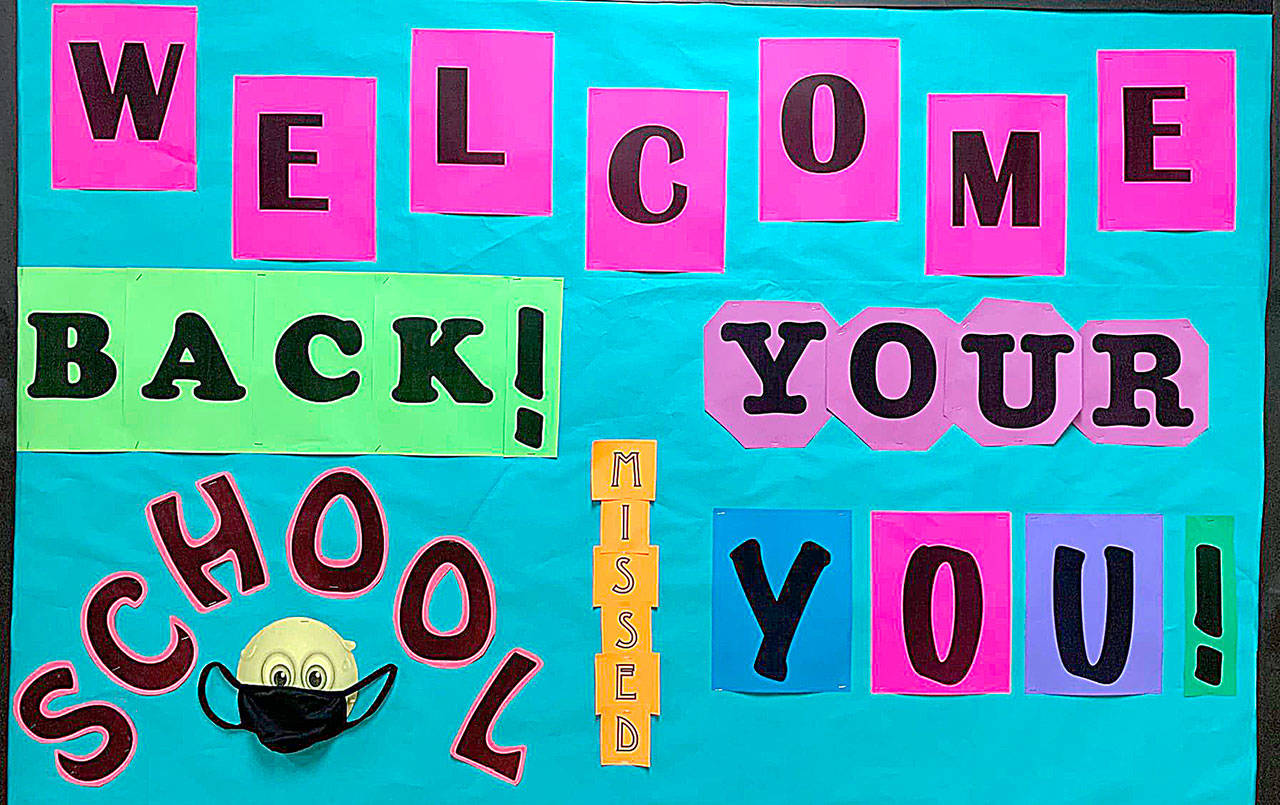 COURTESY PHOTO One of the many colorful “welcome back” signs at Raymond Elementary School. In-person learning resumed Monday, and the school district announced Thursday that an “individual” at the school tested positive for COVID-19.