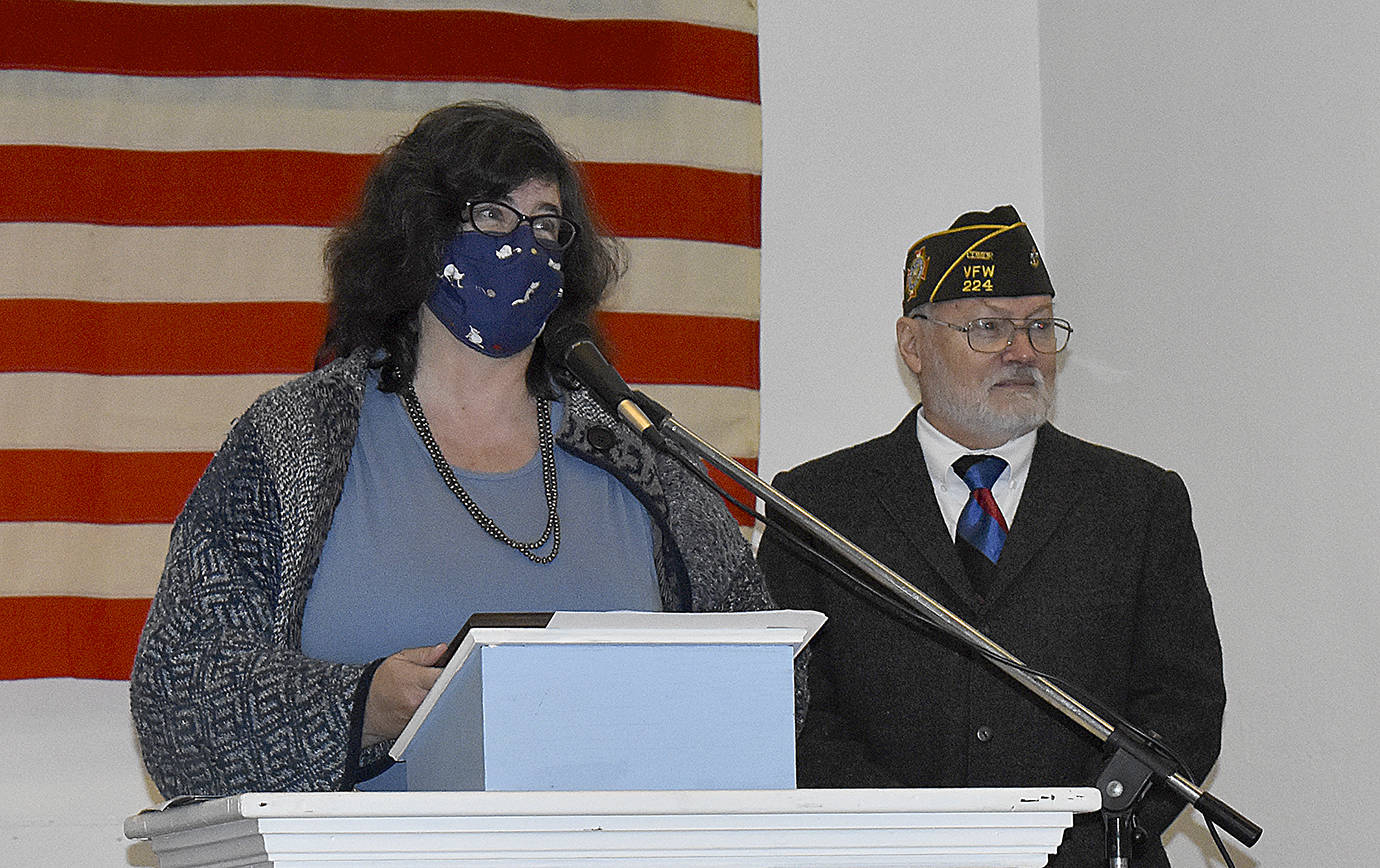 DAN HAMMOCK | THE DAILY WORLD 
Daily World Lifestyle Editor Kat Bryant accepts the VFW’s national publications contest best feature award from Aberdeen VFW Post Commander Anthony Magri.