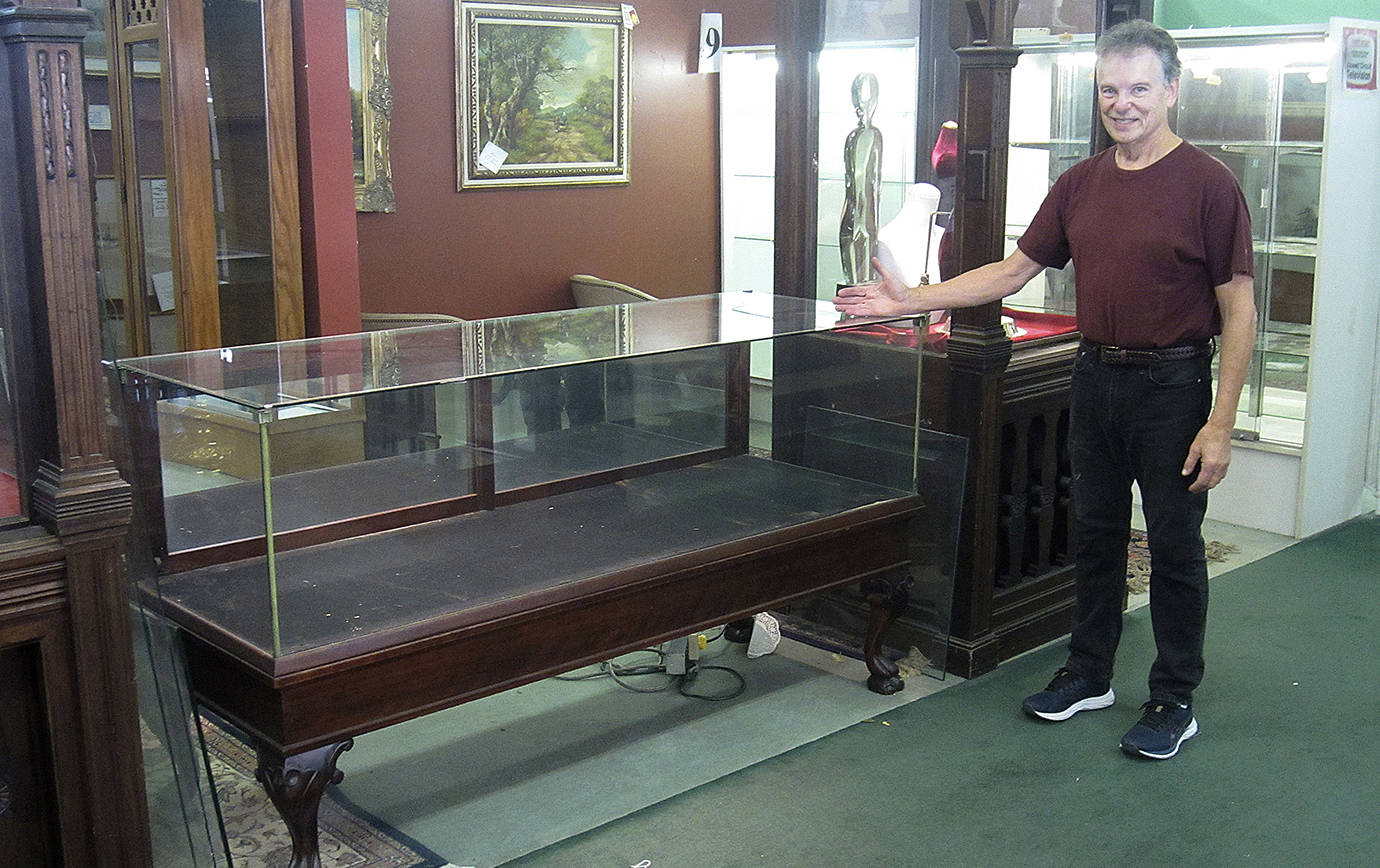 JOHN LARSON | POLSON MUSEUM 
Richard Mirau with one of the six vintage display cases he donated to the Polson Museum Nov. 6.