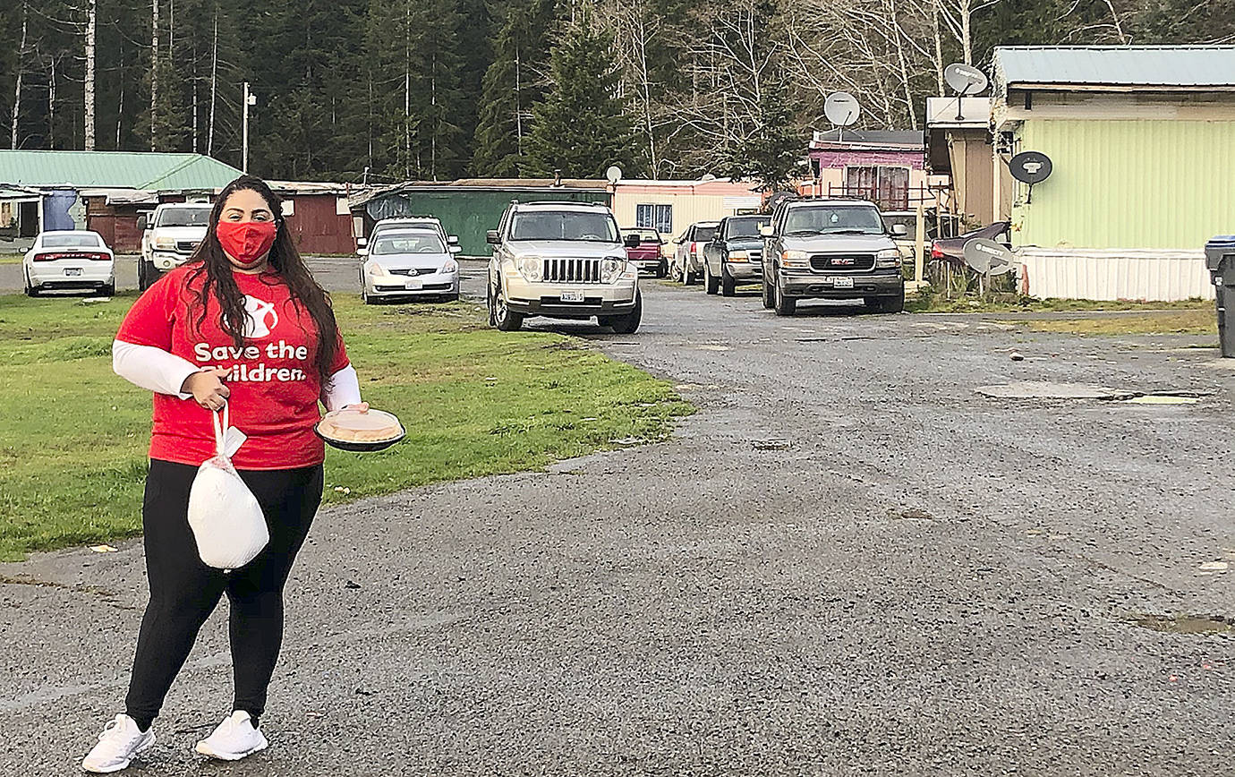 Save the Children Early Childhood Education Coordinator Marisol Castillo helps deliver Thanksgiving meals to families in the Lake Quinault community.