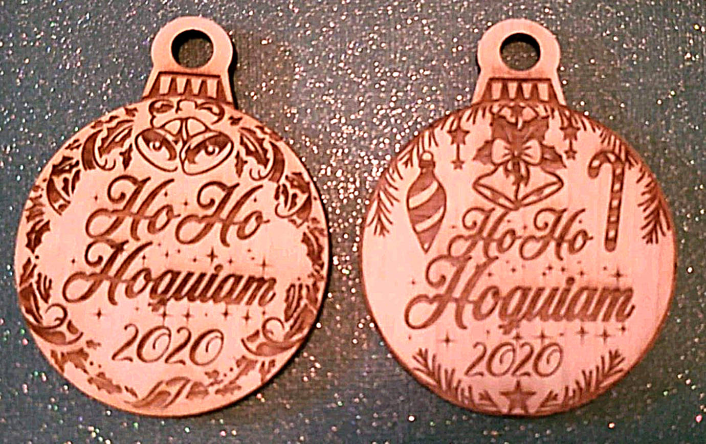 Montesano-based Artsy Arrow Designs created these commemorative laser-cut wood ornaments. About 15 Hoquiam retailers will start handing them out free to visitors on Friday. (Courtesy photo)
