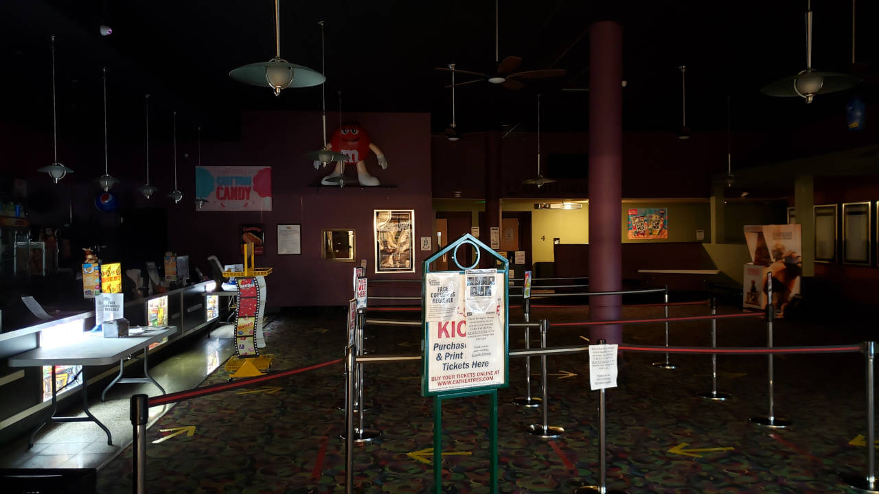 A dark and empty Coming Attractions Theater remains closed until Dec. 14 after the most recent shutdowns by Governor Inslee’s office mandated entertainment-related businesses, such as movie theaters and bowling alleys, close down for four weeks. (Ryan Sparks | The Daily World)