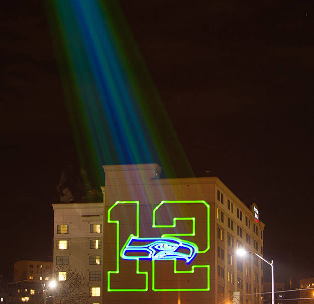 Tukwila-based Slick Lasers, which has helped Seattle celebrate its Seahawks on its skyline, will produce the Dec. 23 light show at the Satsop Business Park. (courtesy photo)