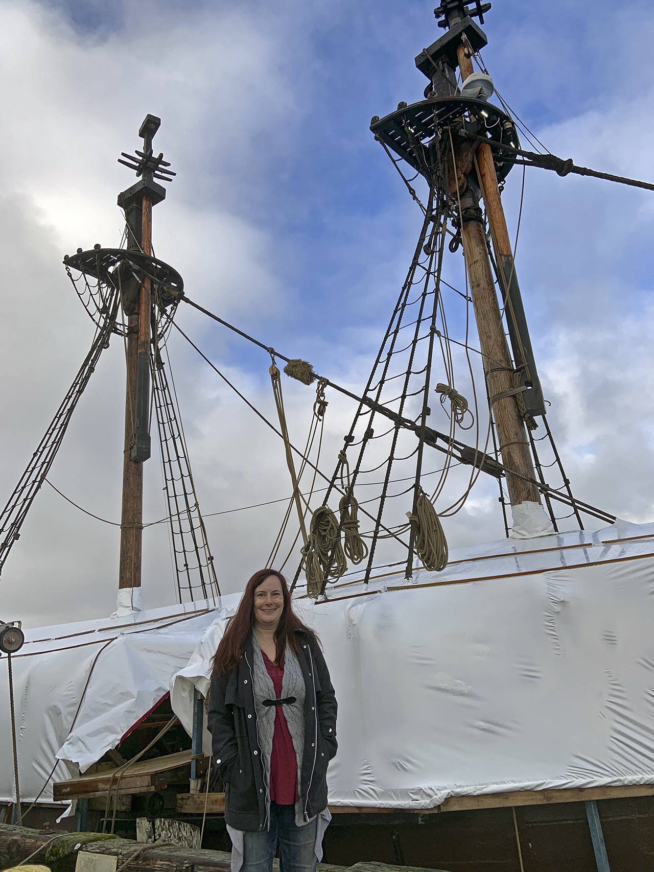 Kat Bryant | The Daily World
Brandi Bednarik, executive director of the Grays Harbor Historical Seaport, stands in front of the downrigged Lady Washington.