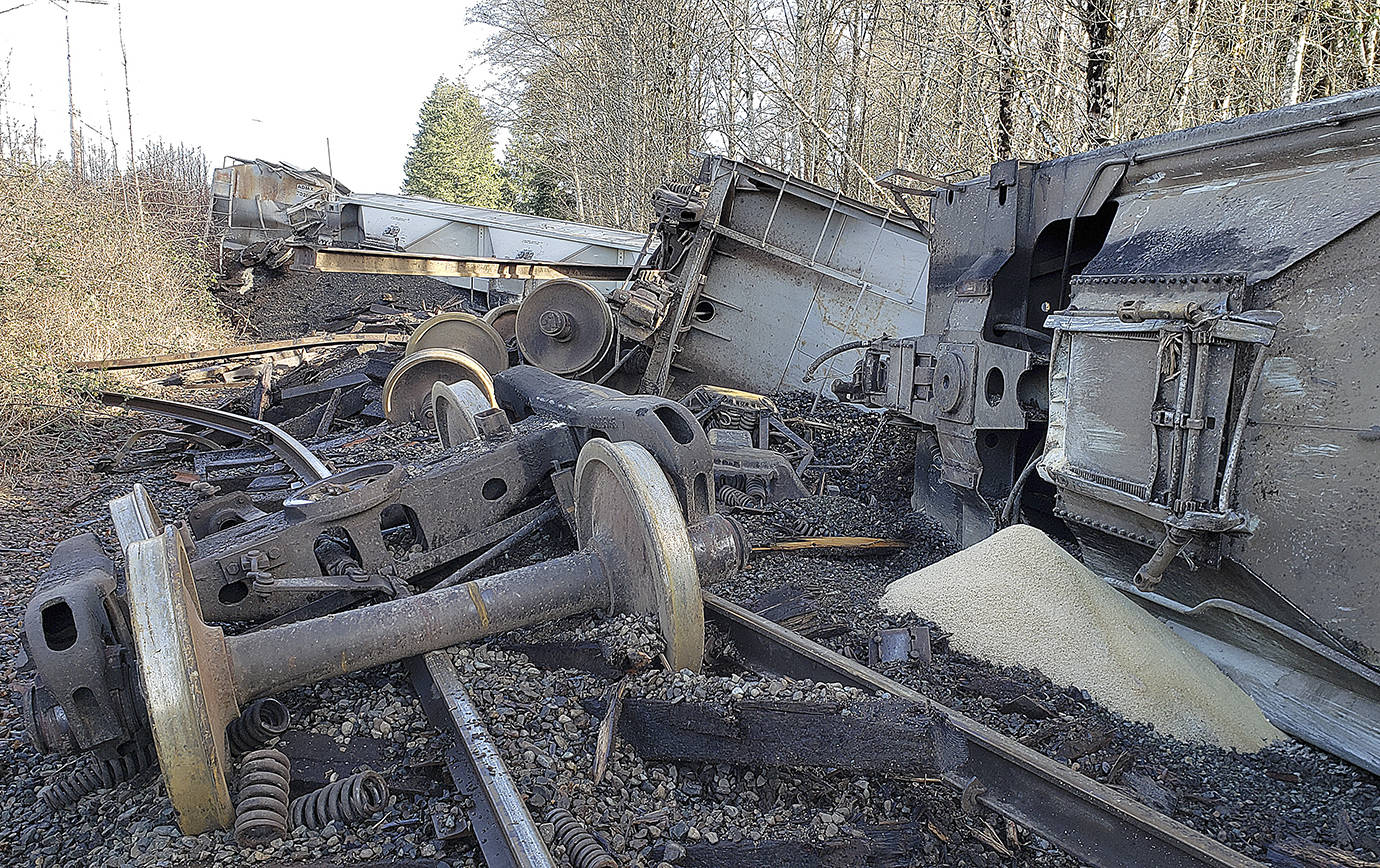RYAN SPARKS / THE DAILY WORLD 
Six boxcars carrying grain derailed Monday afternoon in Montesano. Crews were working to upright and remove the cars Tuesday morning.