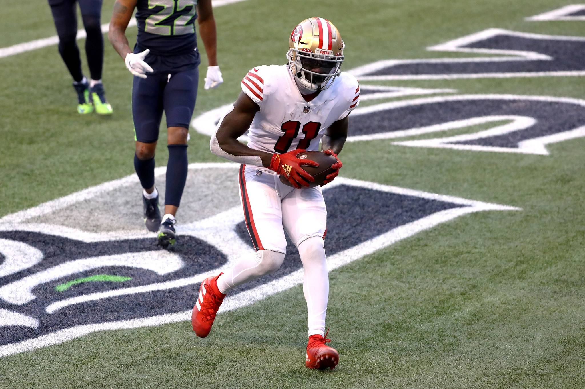 Abbie Parr/Getty Images 
San Francisco 49ers wide receiver Brandon Aiyuk scores a touchdown in the fourth quarter against the Seattle Seahawks in Seattle on Nov. 1. The wide receiver has become one of the 49ers’ top targets in his rookie year.