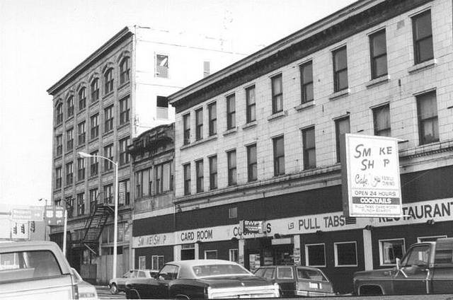 Built in 1911, the Fairmont Hotel at 215 East Heron Street was better known to locals as the Smoke Shop building by the time this photo was taken in the 1970s. On the corner of H Street stood Aberdeen’s first skyscraper, the five-story Finch Building. The small building squeezed in between with the ornate cornice was a theater for years but by the ’70s was a taxi stand. The Fairmont building burned in a spectacular fire in August 1996 while being renovated into apartments and retail spaces. (Roy Vataja Collection)