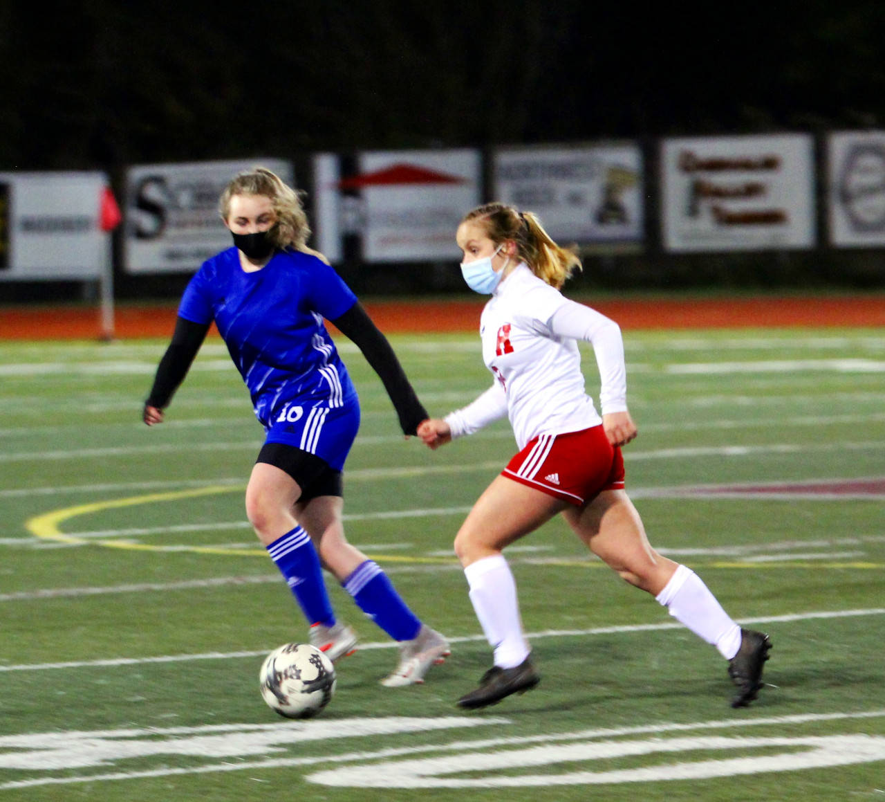 Hoquiam senior Sadie Carlyle, right, dribbles against Elma on Tuesday at Jack Rottle Field in Montesano. Carlyle’s hat trick led to a 4-1 season-opening win over the Eagles. (Photo courtesy of Ben Winkelman)