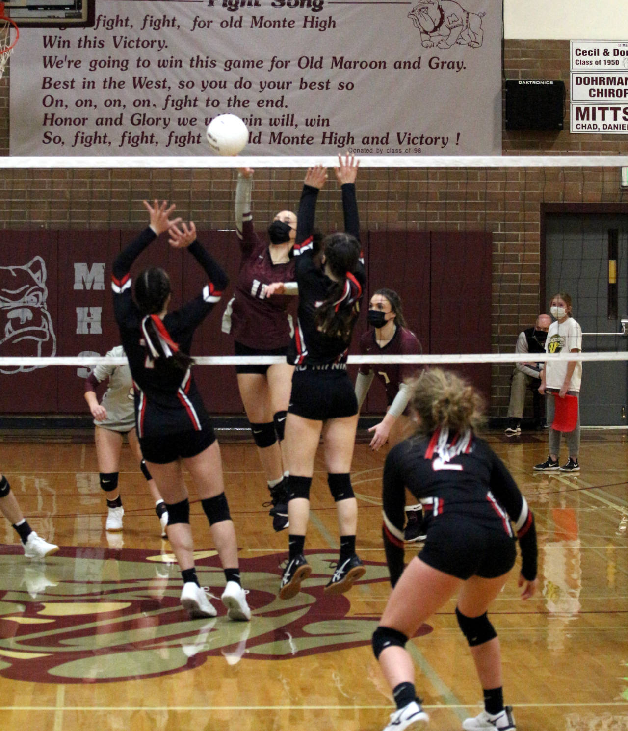 Montesano’s Miai Young, middle, records a kill during the Bulldogs’ straight-set victory over Tenino on Tuesday in Montesano. (Ryan Sparks | The Daily World)