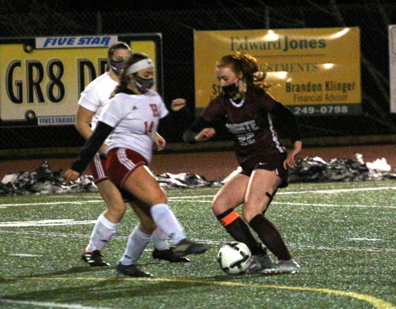 Montesano senior Zoee Lisherness (22) battles for possession with Hoquiam defender Emiley Elders during the Bulldogs’ 6-0 victory on Tuesday in Montesano. Lisherness scored three goals in the contest. (Ryan Sparks | The Daily World)