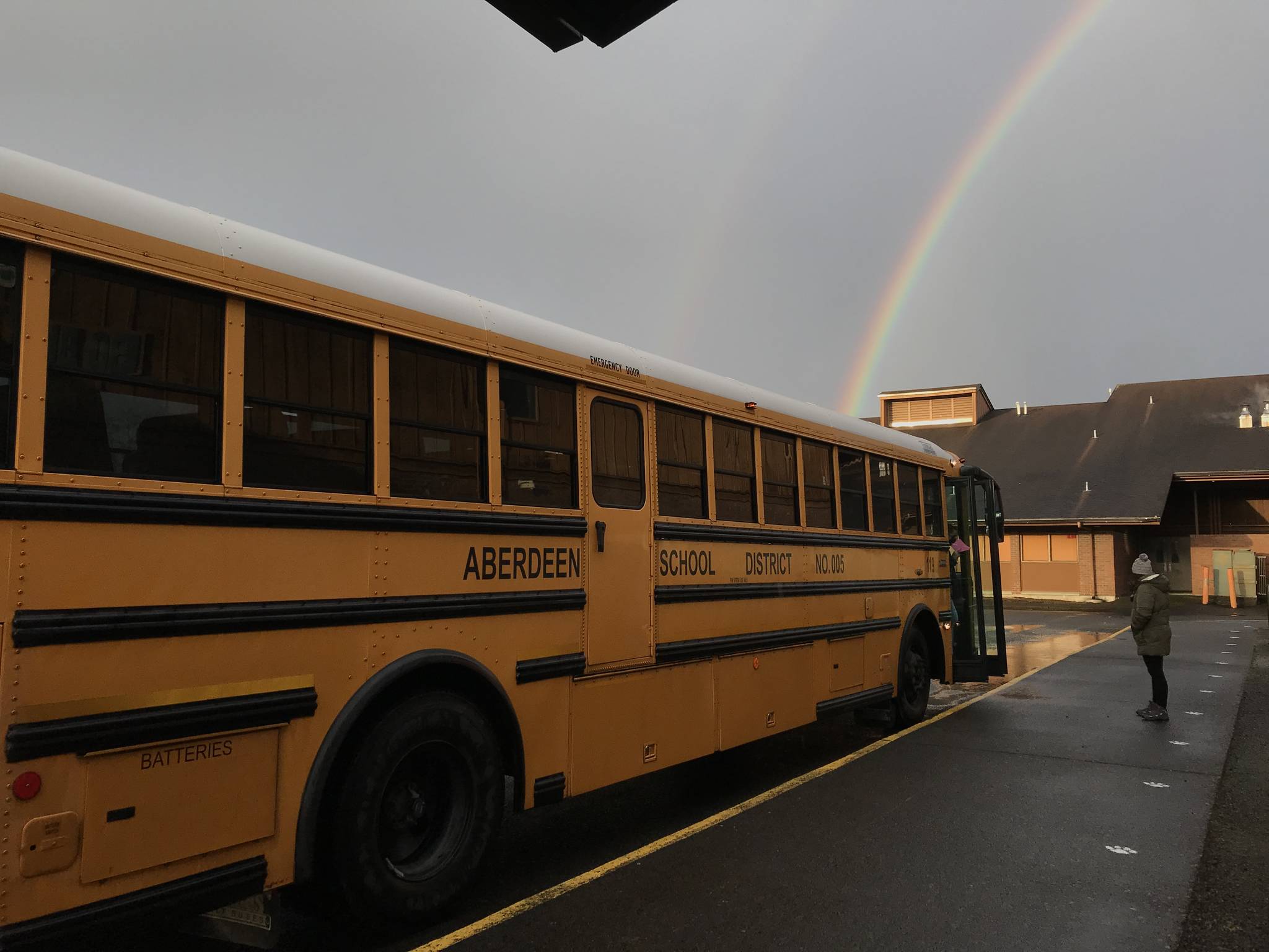 Miller Junior High photo 
A Miller Junior High student awaits the bus under a double-rainbow.