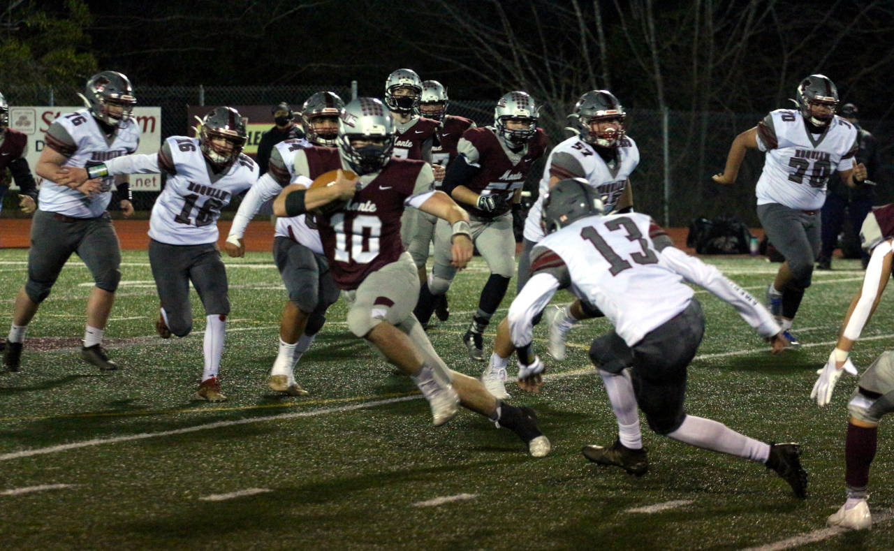 Montesano quarterback Trace Ridgway (10) avoids the tackle of Hoquiam defender Owen McNeill during Friday’s game at Jack Rottle Field in Montesano. (Ryan Sparks | The Daily World)