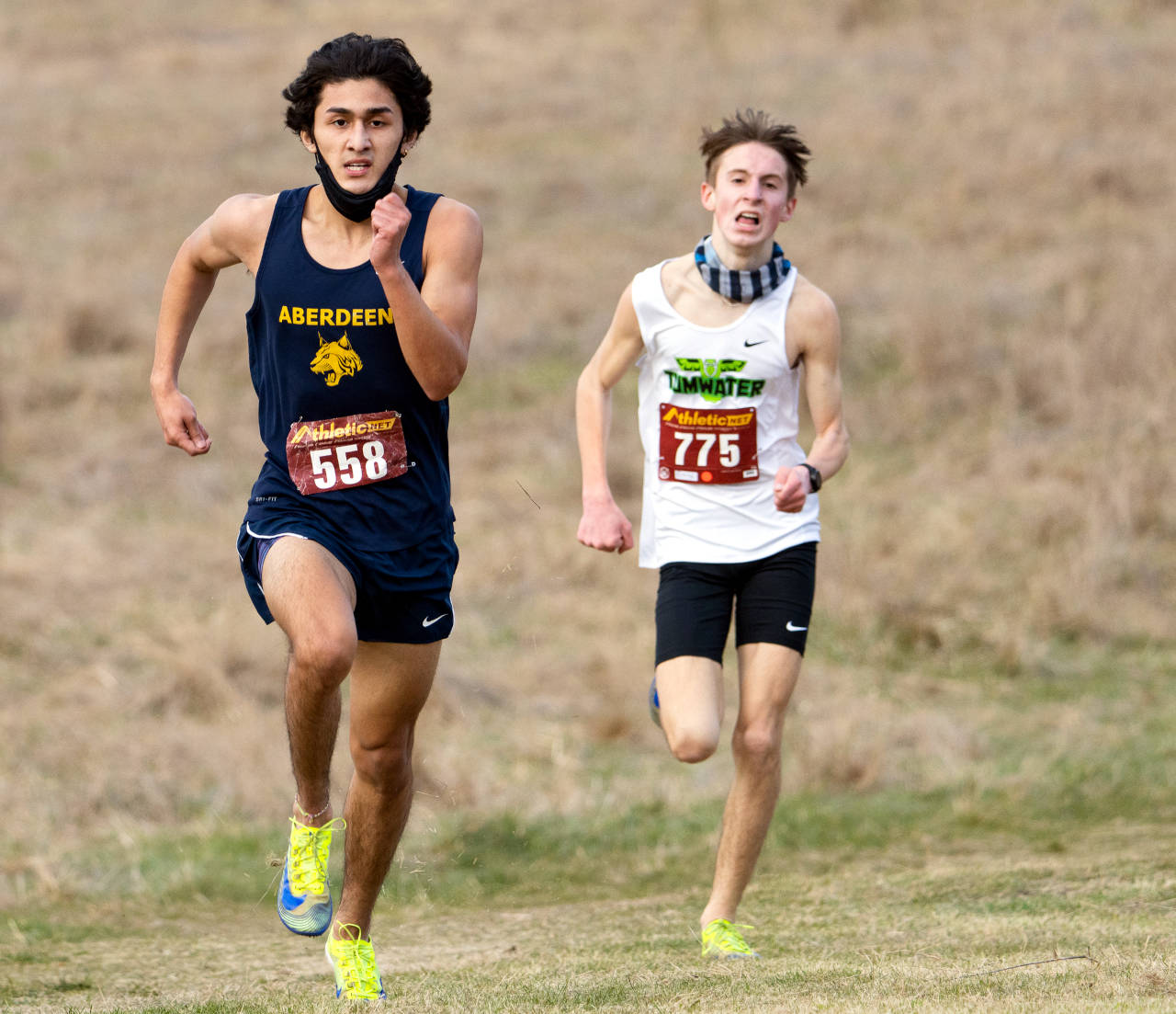 Aberdeen’s Julian Campos, left, heads to the finish line ahead of Tumwater’s John Hoffer to win the 2A Evergreen Conference Championship on Saturday in Shelton. (Justin Johnson | Mason County Journal)