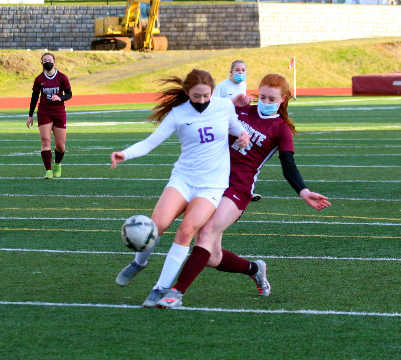 Montesano’s Zoee Lisherness, right, collides with Goldendale’s Payton Sheridan during a first-round district playoff game on Monday in Montesano. (Ryan Sparks | The Daily World)