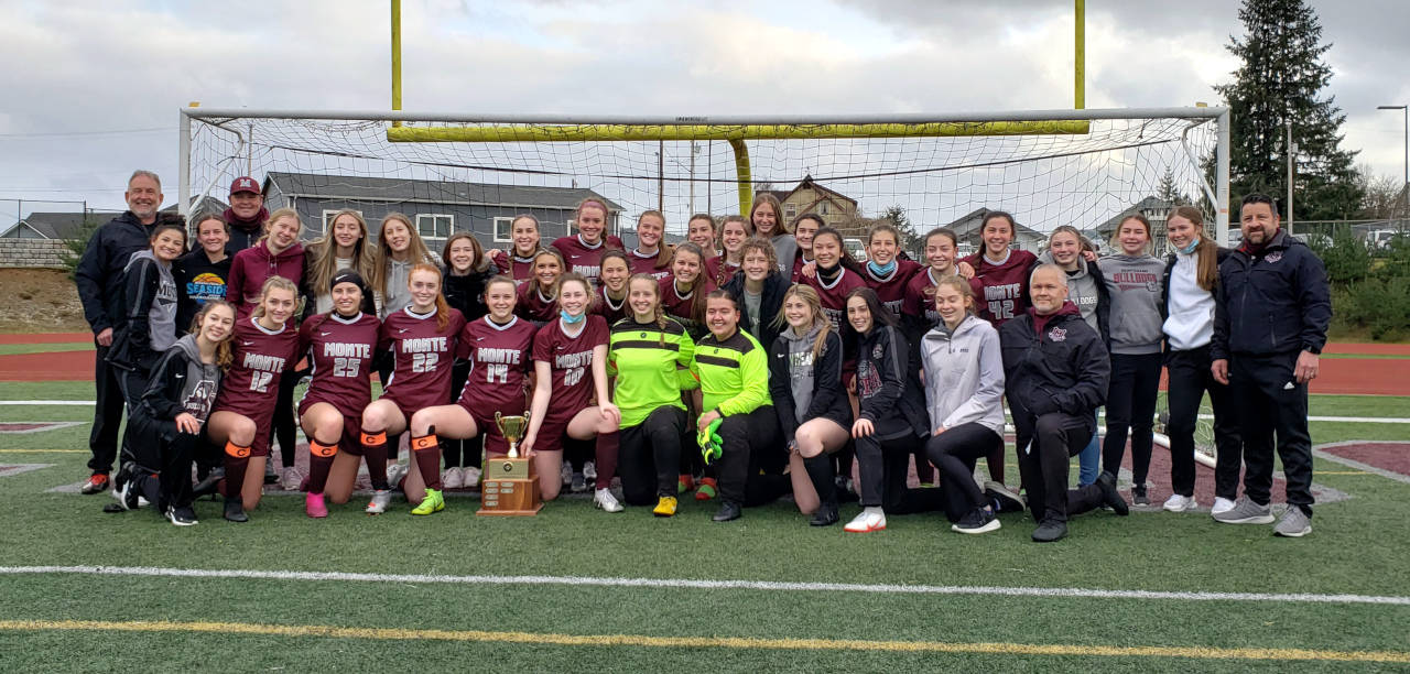 The Montesano Bulldogs pose for a photo after winning the 1A District 4 championship with a 3-0 victory over Tenino on Saturday at Jack Rottle Field in Montesano. (Ryan Sparks | The Daily World)