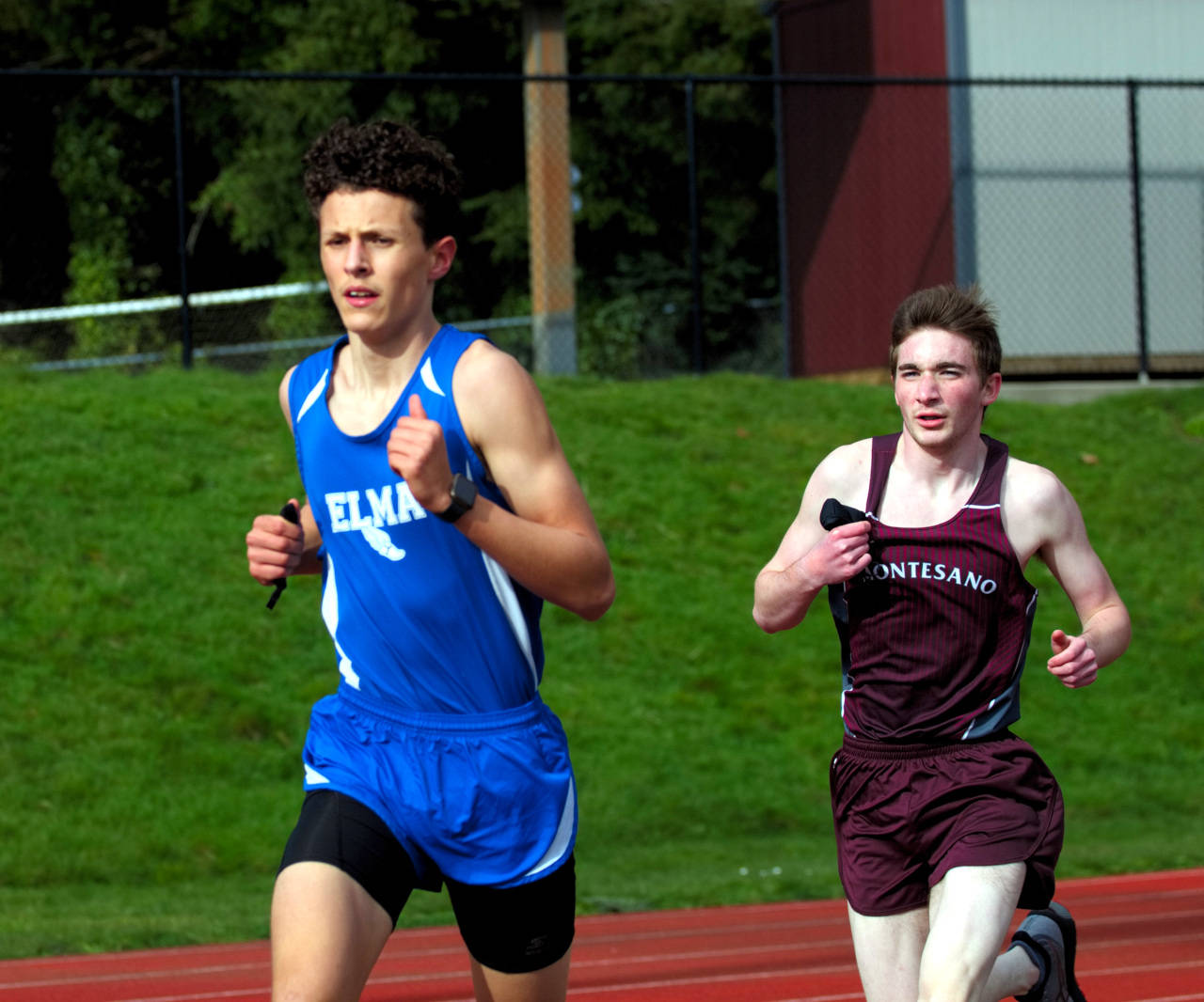 Elma sophomore Elijah Flores, left, leads Montesano’s Aric Jacklin during the boys 1,600 meter race during a 1A Evergreen League Meet at Montesano on Wednesday. (Ryan Sparks | The Daily World)