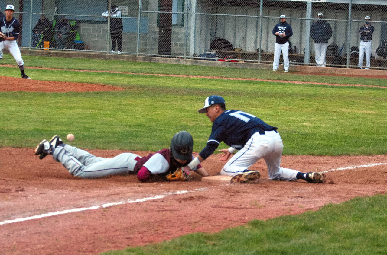 Montesano’s Jack Anderson slides in safely to third base during the Bulldogs’ 5-4 victory over River Ridge on Friday at Vessey Field in Montesano.(Ryan Sparks | The Daily World)