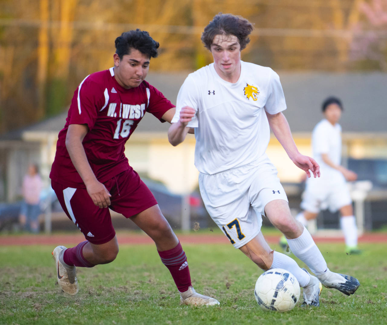 Aberdeen’s Logan Sias, right, dribbles against WF West during the Bobcats 3-1 season-opening loss on Tuesday in Chehalis. (Eric Trent | The Chronicle)