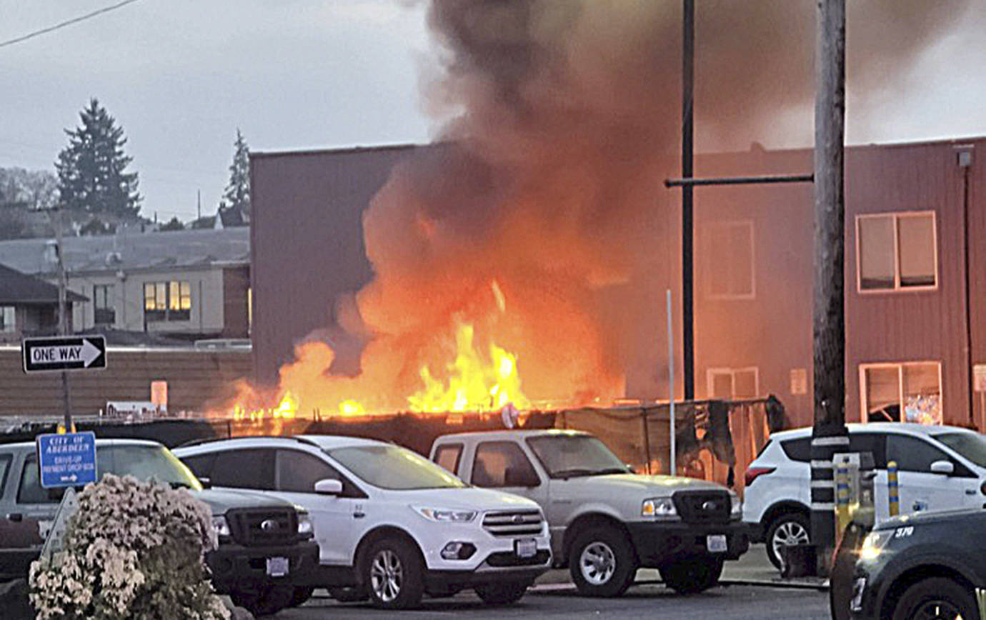 COURTESY AMY BLEDSOE 
Amy Bledsoe of Montesano captured this image of a fire at the Aberdeen homeless camp next to City Hall Thursday morning.