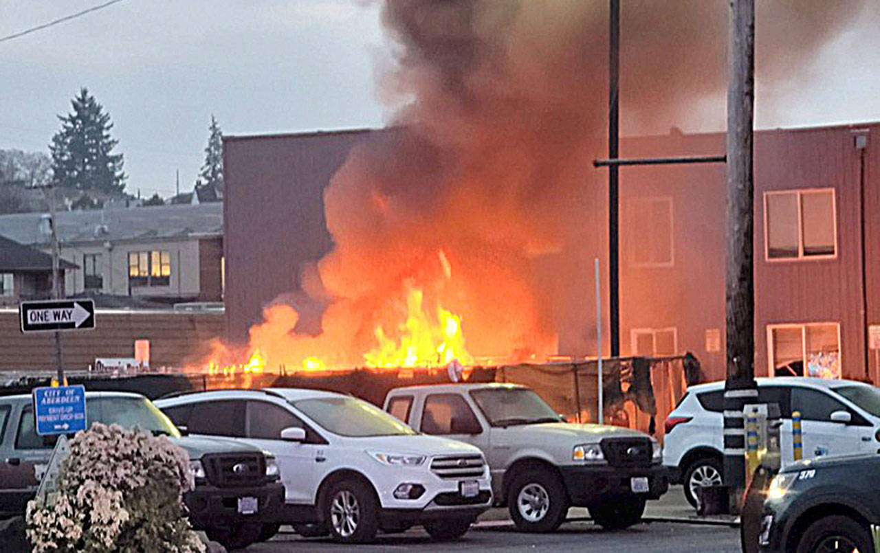 COURTESY AMY BLEDSOE 
Amy Bledsoe of Montesano captured this image of a fire at the Aberdeen homeless camp next to City Hall Thursday morning.