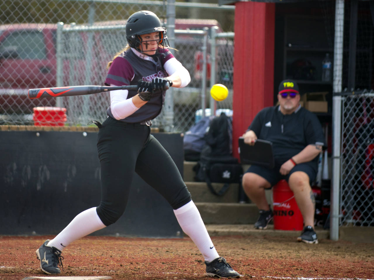 Montesano shortstop Paige Lisherness takes a swing during the Bulldogs’ doubleheader against Tenino on Friday in Tenino. (Eric Trent | The Chronicle)