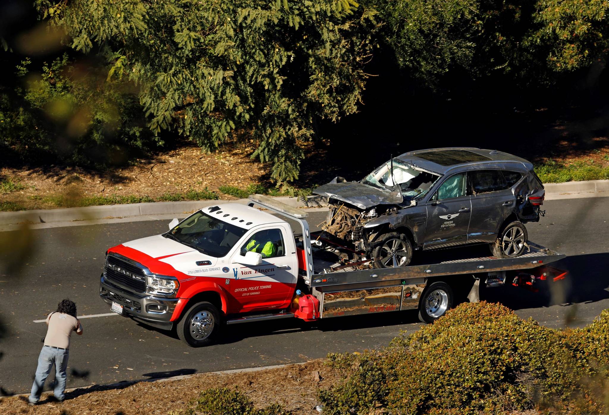 Carolyn Cole/Los Angeles Times 
The vehicle driven by Tiger Woods is towed away on Hawthorne Boulevard after he ran off the road and sustained injuries on Feb. 23.