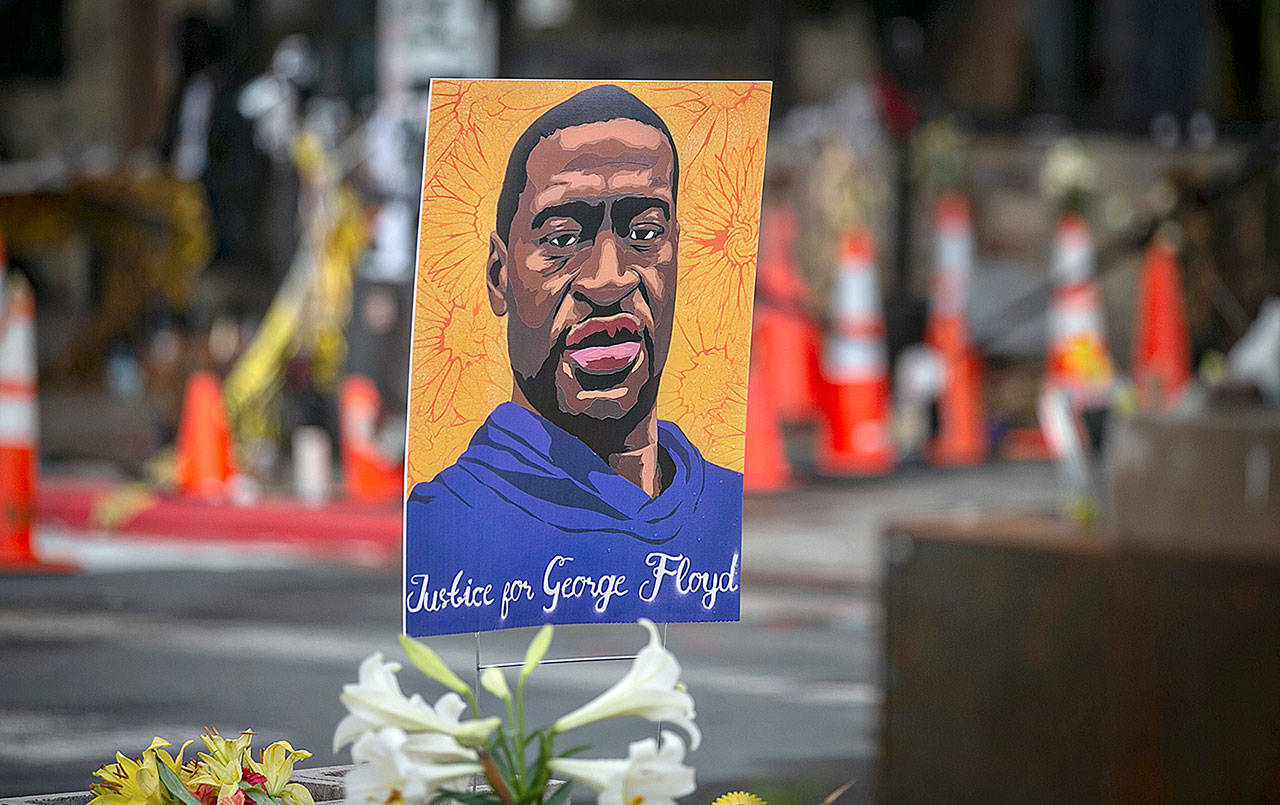 Images of George Floyd are placed all around the area surrounding Cup Foods, where Floyd was killed in Minneapolis. (Jason Armond/Los Angeles Times/TNS)