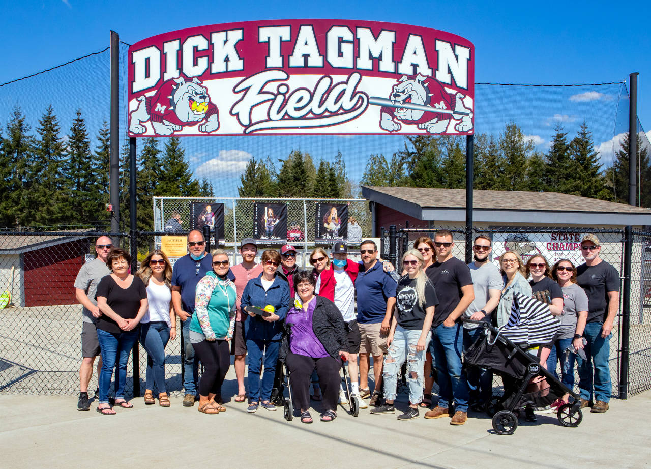 PHOTO BY SHAWN DONNELLY 
Members of the Tagman family pose for a photo in front of the recently unveiled Dick Tagman Field at Montesano High School. The Montesano softball field was named Dick Tagman Field at a dedication ceremony that drew several hundred people on Tuesday afternoon. The Tagman family have been large benefactors to the Montesano School District for several years.