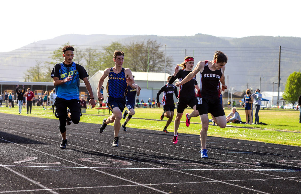 PHOTO BY LARRY BALE Ocosta’s William Idso, right, wins the boys 100 meter race at the 2B Pacific League Championship Meet on Thursday in Raymond.