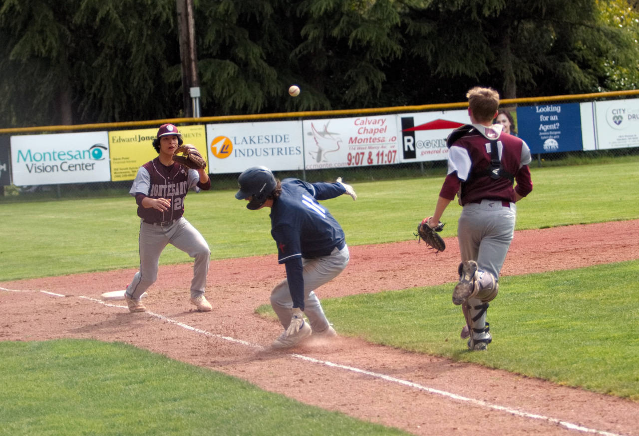 RYAN SPARKS | THE DAILY WORLD Montesano third baseman Isaac Pierce, left, and catcher Josh Wills have King’s Way Christian’s Max Mitchell caught in a rundown during a 1A District 4 semifinal game on Tuesday at Vessey Field in Montesano.