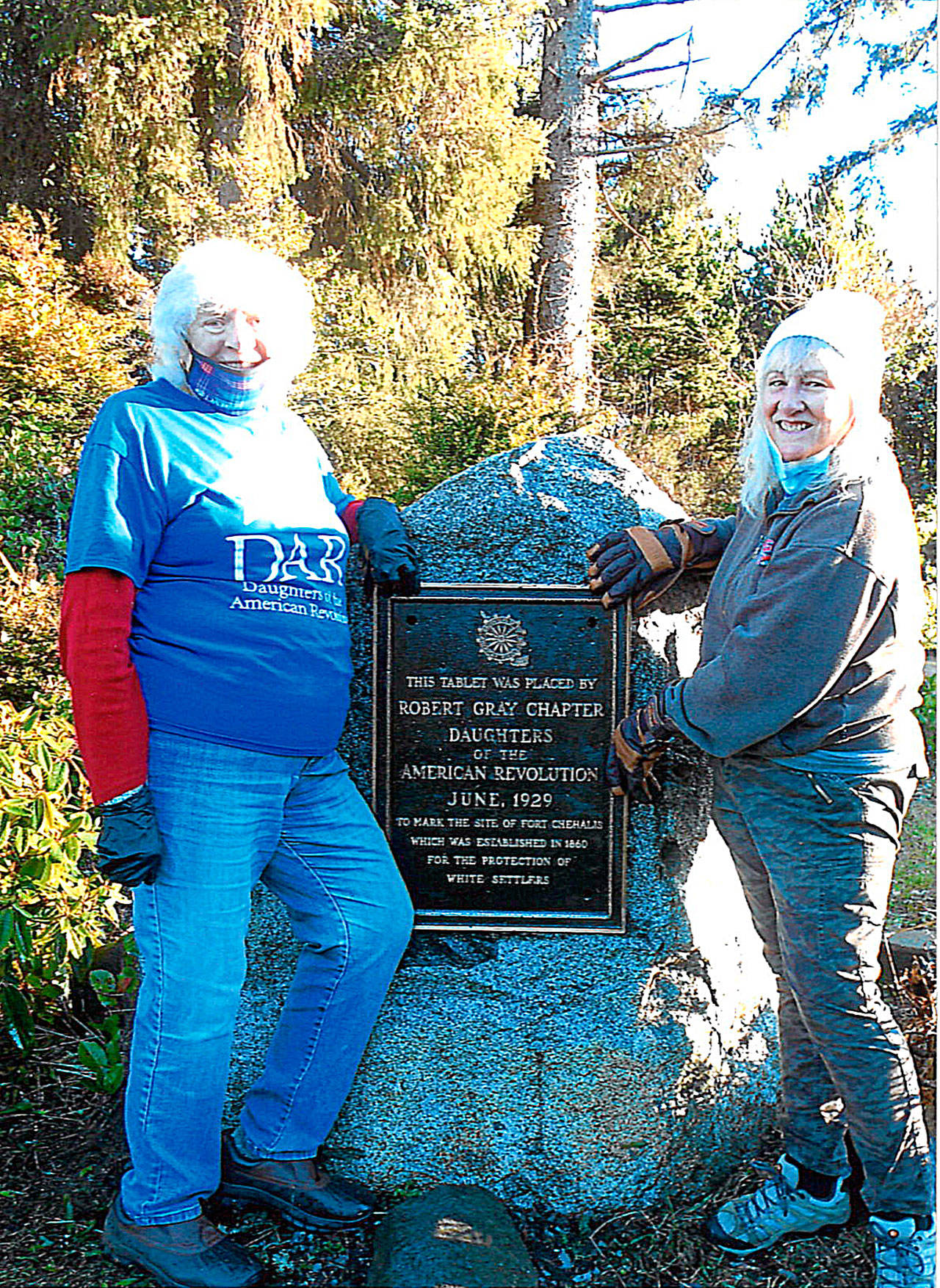 Photos COURTESY JOYCE THOMASSON 
Joyce Thomasson, left, and Bette Jean “BJ” Fisher stand alongside the newly-restored Fort Chehalis monument, which will be re-dedicated Saturday, May 8 at Westport City Park.