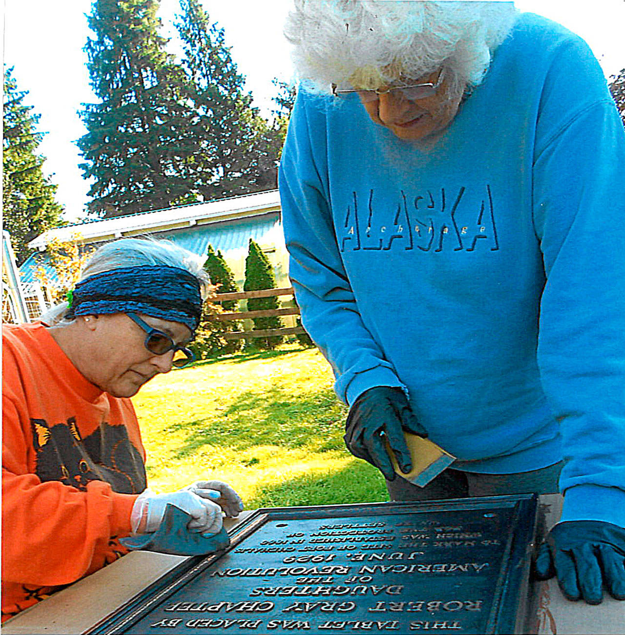 Bette Jean “BJ” Fisher, left, and Joyce Thomasson helped restore the Ft. Chehalis Monument marker.